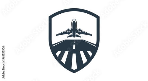 Airplane taking off from runway within a protective shield emblem.