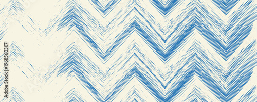 Grunge grainy blue brush stroke with spray texture. Hand drawn distress damaged vintage banner with zigzag bold line. Rough thick brush stroke texture. Spray paint effect vector background.