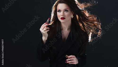 Luxury beauty brunette with red lipstick close-up