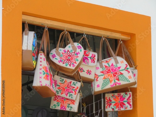traditionally embroidered purses and bags in a market in Mexico