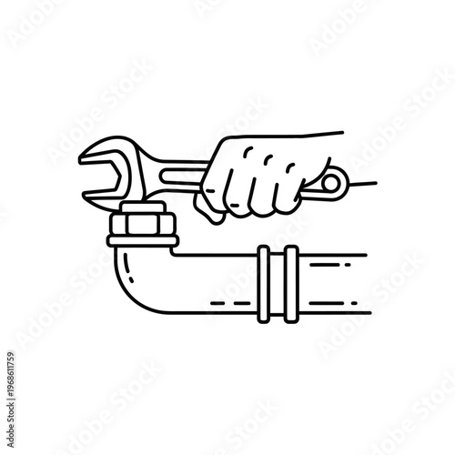 Hand holding adjustable wrench on pipe.