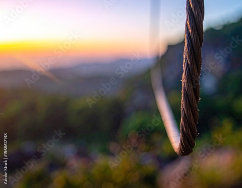 Closeup of Rusty Steel Cable with Blurred Nature Background.