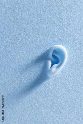 blue background featuring an ear with foam