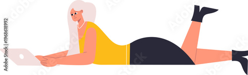 Woman working on laptop lying on stomach