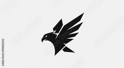 A striking black geometric eagle or hawk logo with sharp wings and a fierce profile against a light grey background, symbolizing strength and precision.