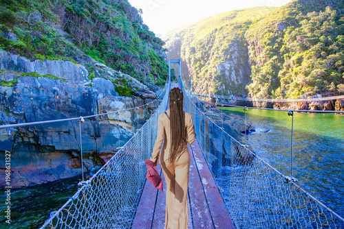 The suspension bridge over the storms river mouth within Tsitsikamma National Park - Eastern Cape in South Africa. It is an important tourist destination along the Garden Route.