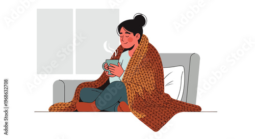 A woman sitting on a couch wrapped in a warm blanket holding a steaming mug