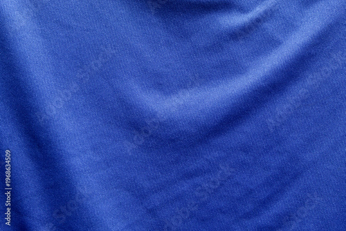 Dark blue polyester fabric texture with microfiber details and soft pleats