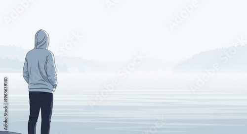 Man in Hoodie Looking at Misty Lake and Hills