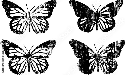 Four vintage butterfly silhouettes with delicate wings and detailed patterns in monochrome