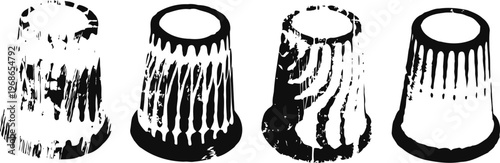 four vintage thimbles with distinct textured patterns and wear marks in black and white