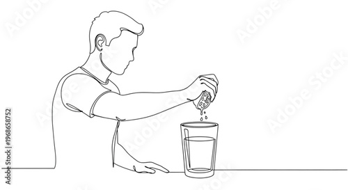 Man squeezing lemon into glass of water at simple table setting  