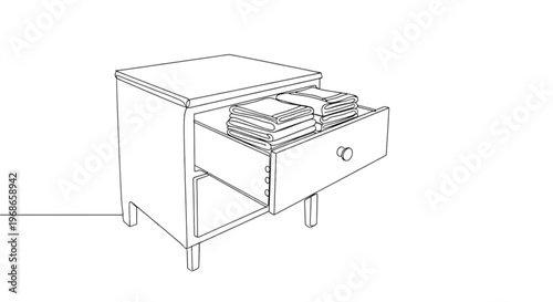 Drawer in a side table filled with neatly stacked tea towels  