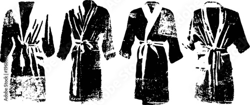 Four cozy bathrobes hanging on hooks, soft casual home wear with belts