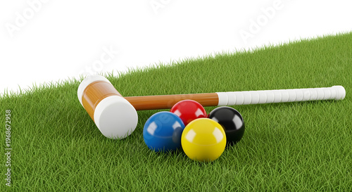 A set of colorful croquet balls and mallets on a grassy field