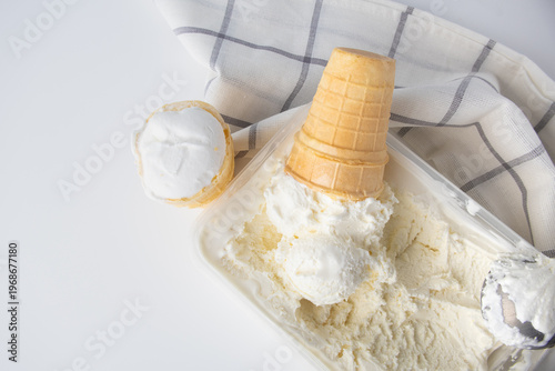 Vanilla Ice Cream with Scoop and Waffle Cone