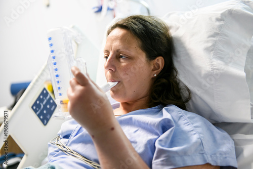 woman in hospital bed suffering from cancer or other health problem