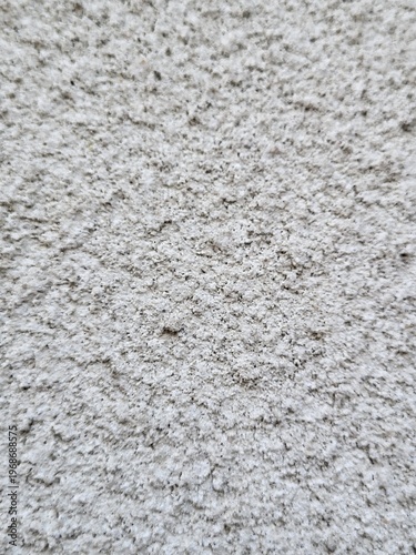 Decorative concrete wall finish with large embossed stone imitation and a rough textured surface.