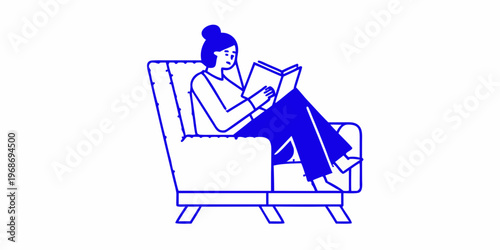 Woman comfortably reading a book while relaxing in a stylish armchair