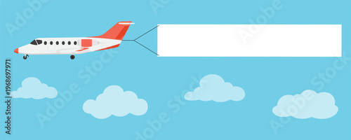 Private jet airplane flying in the blue sky with clouds and pulling a blank white rectangular banner for advertising or message.