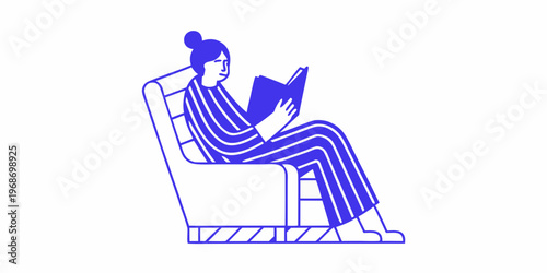 A woman relaxes in a chair deeply engrossed in reading a book