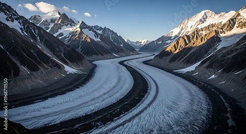 Majestic Glacier River Flowing Through Towering Mountains.