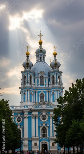 Stunning Smolny Cathedral in Saint Petersburg, Russia, under dramatic sky.