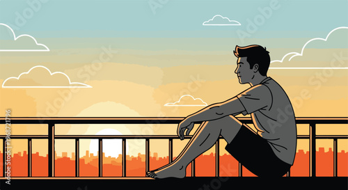A young man sitting on a balcony railing watching the sunset over a cityscape