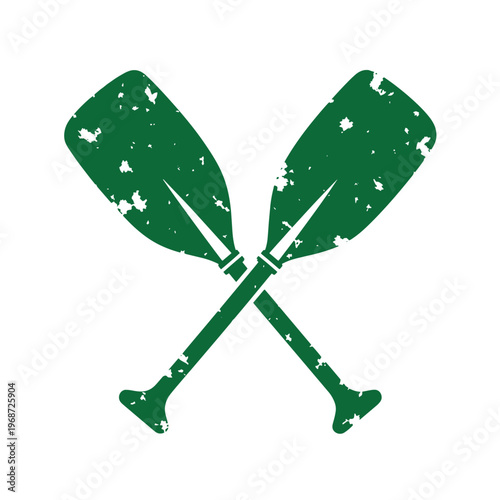 Green distressed oars crossed over each other paddles