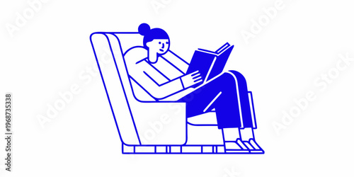 A person relaxes in a chair deeply engrossed in reading a book