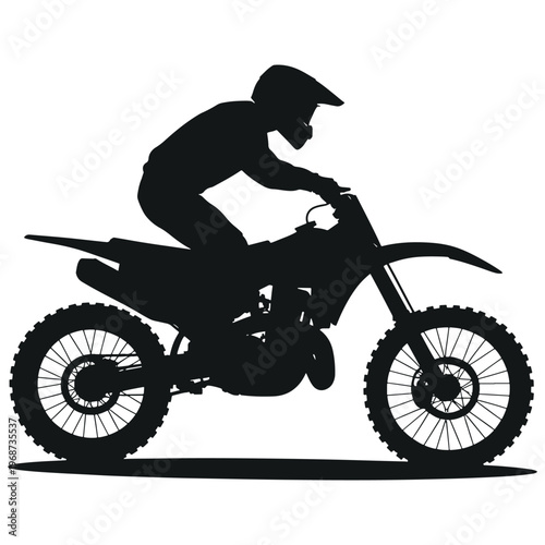 Dynamic silhouette of a motocross rider on a dirt bike in action