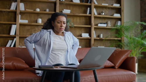 Woman with back pain after laptop work
