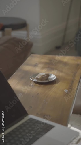 “Pastry on a Plate by a Laptop 4K Ultra HD Video, Cozy Work From Home or Cafe Setup, Delicious Breakfast or Snack Scene, Coffee Table with Dessert, Modern Lifestyle Footage, Stock Video