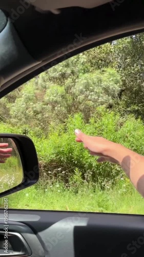 Hand Reaching Out of Car Window Travel Freedom Road Trip Adventure Motion Lifestyle Journey Wind Driving Scenic Outdoor Cinematic Experience 4K Video
