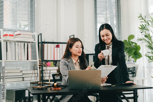 A female lawyer who trains and mentors new employees at the law firm.