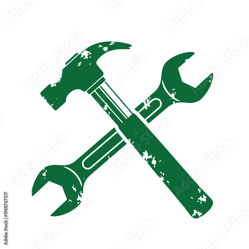 Green distressed crossed hammer and wrench with a weathered texture isolated on a white background representing construction and repair work
