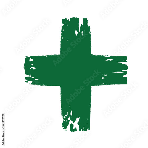 Green cross symbol created with rough dry brush strokes isolated on a plain white background for medical and healthcare signage