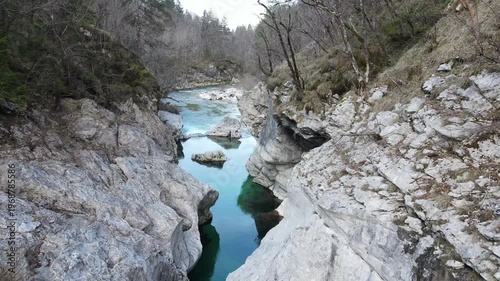 Aerial drone footage tilting from top down view of Soča river canyon to scenic alpine landscape in Slovenia