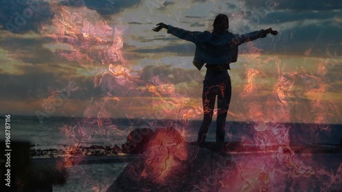 Woman walking on rocks, holding phone and activating pink overlay while extending arms wide for ads