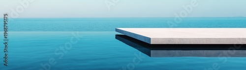 Minimalist Horizon A pristine white concrete platform reflects in the calm blue infinity pool, merging with the tranquil sea and sky. Serene architectural escape, modern tranquility.