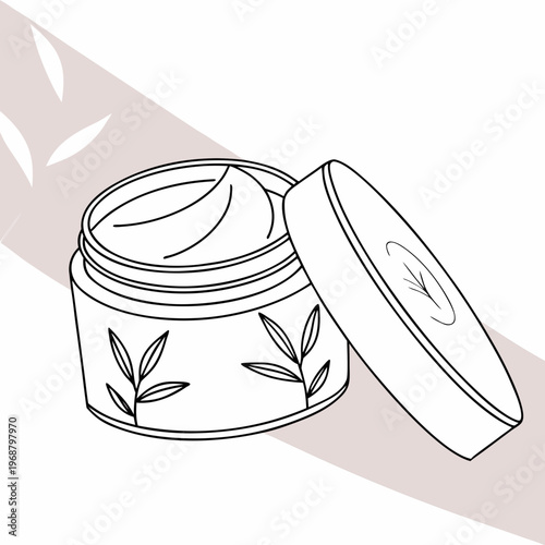 A jar of cream with a leaf design on the front