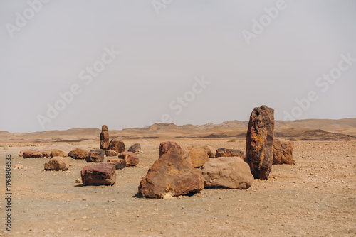 Obraz na plátně Standing geological rock formations and scattered stones in Negev desert near Mi
