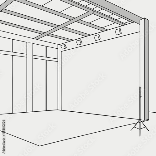 A large empty room with a metal frame and lighting