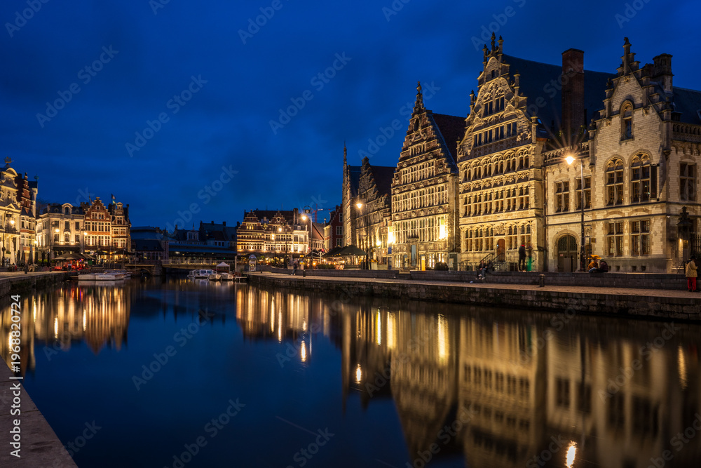Fototapeta premium Night view of historic guild houses on Graslei quay in Ghent, Belgium.
