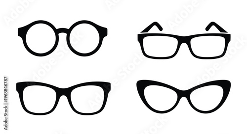 Four pairs of black eyeglasses displayed in a simple minimalist arrangement