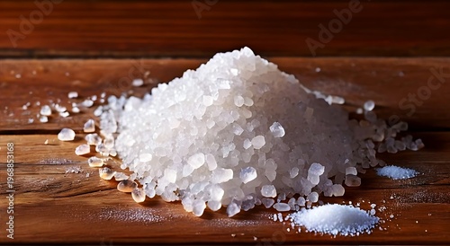 Coarse salt crystals on wooden surface, soft lighting creates warm ambiance, texture of wood and salt visible