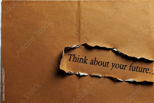 Torn brown paper with motivational text 'Think about your future'