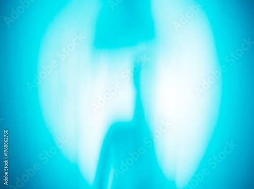 Aqua blue alien silhouette abstract bokeh backdrop