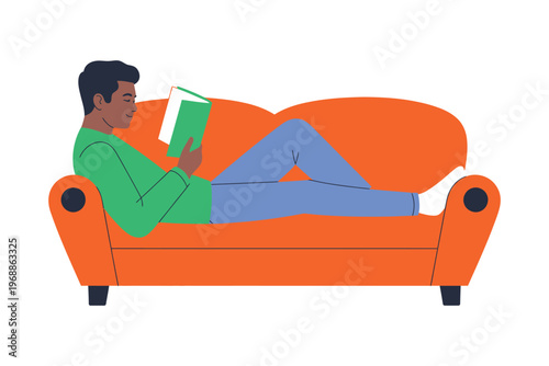 A man relaxing on an orange couch while reading a green book