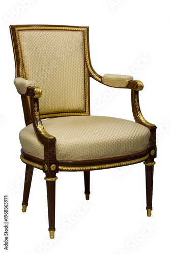 Exquisite vintage chair with elegant design and golden accents from a bygone era in a bright room